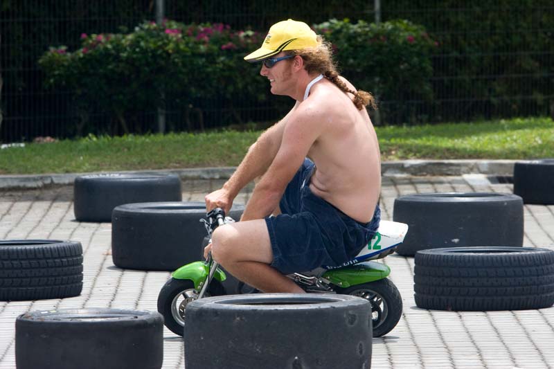 tourist guy on mini bike Malaysia Pictures - Kuala Lumpur Pictures